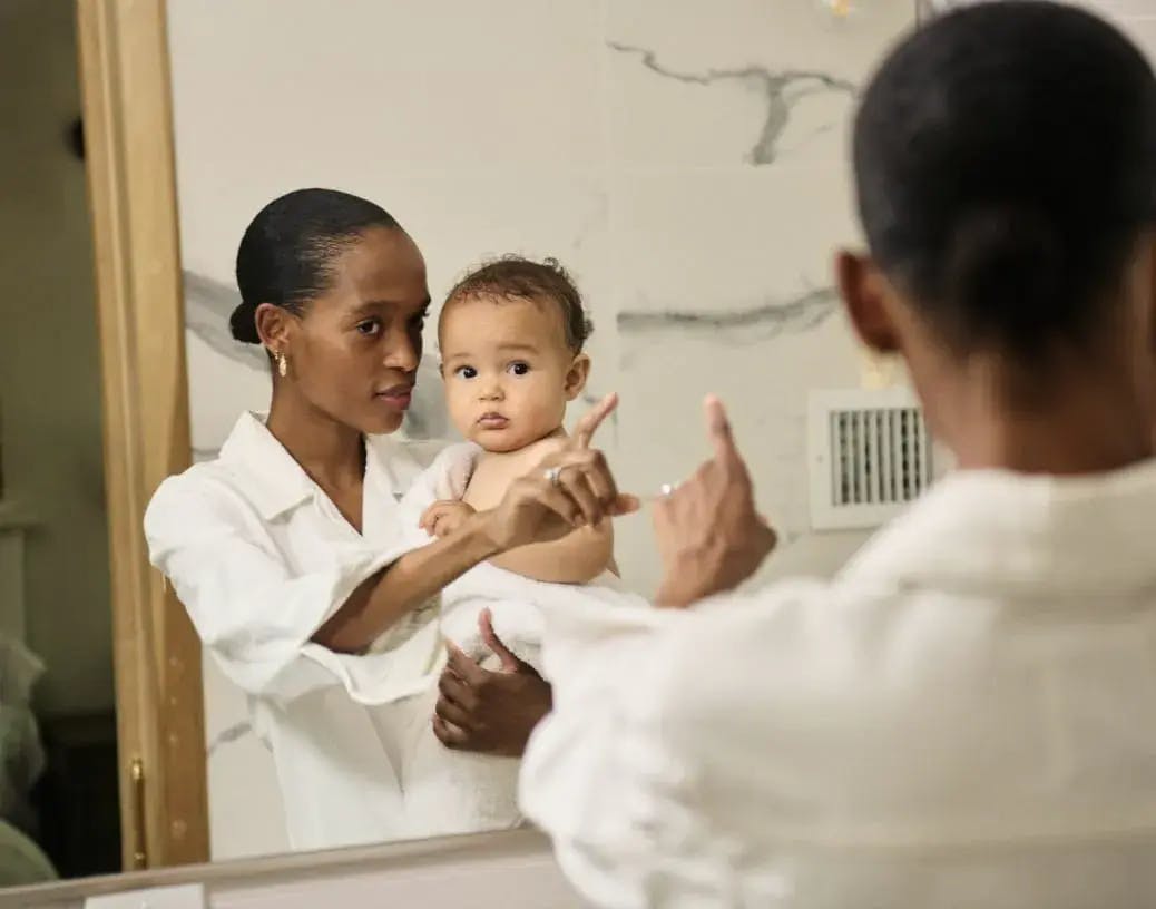 African American Mom With Baby in Mirror